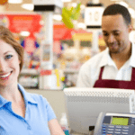 Girl and guy at checkout.